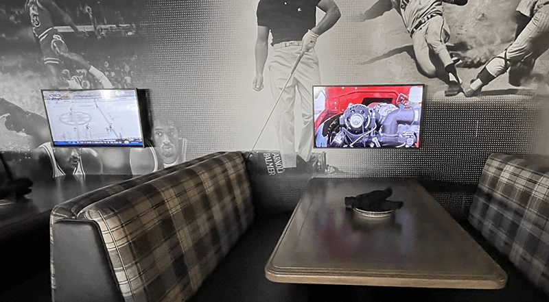 Digital signage displays in a legacy sports arena eating area